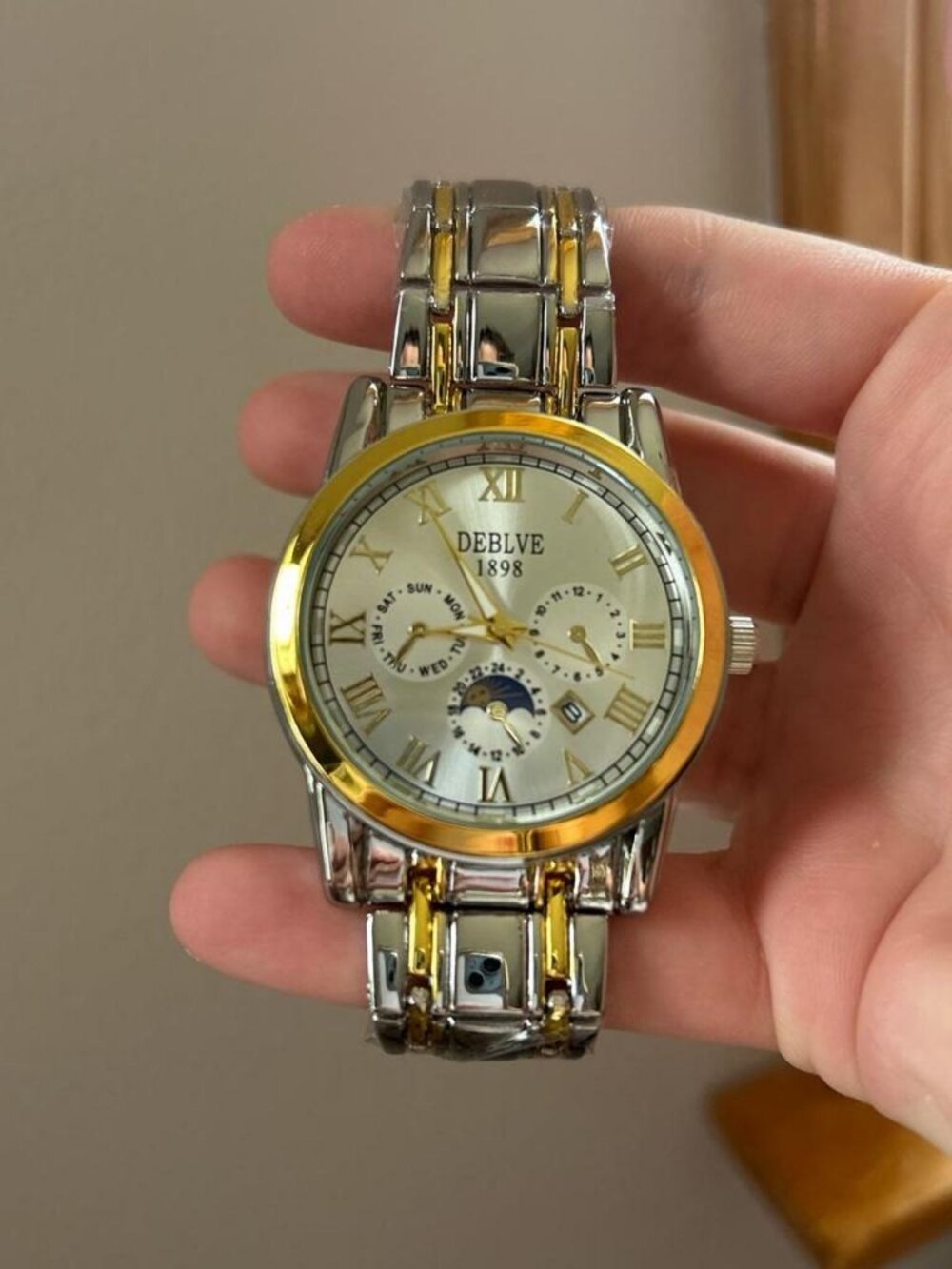Silver and gold analogue watch